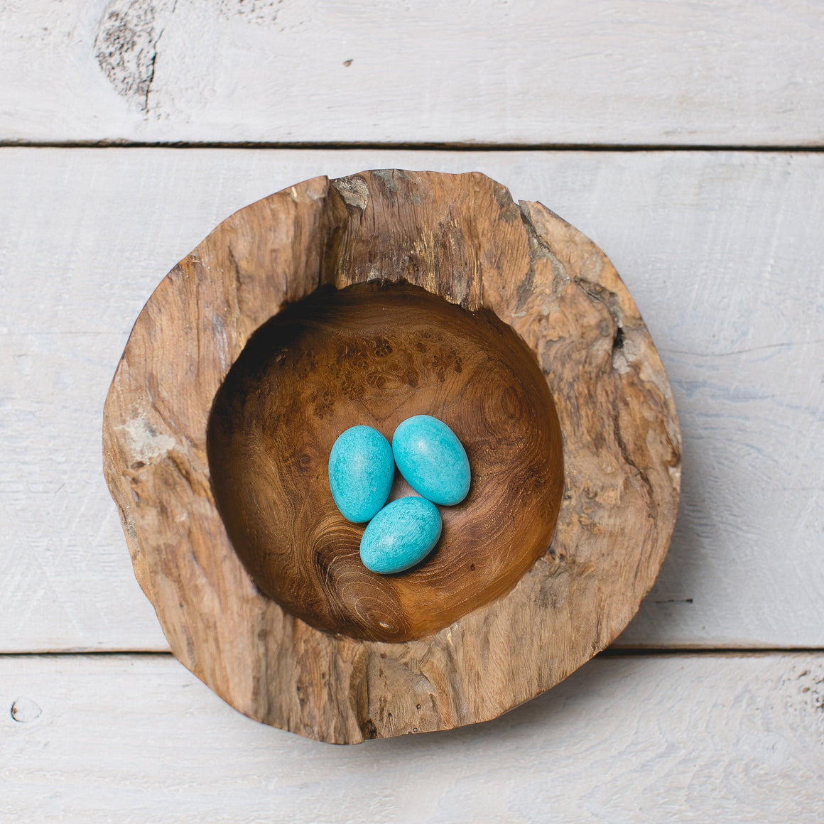 Hand carved wooden nest with robins eggs pale blue