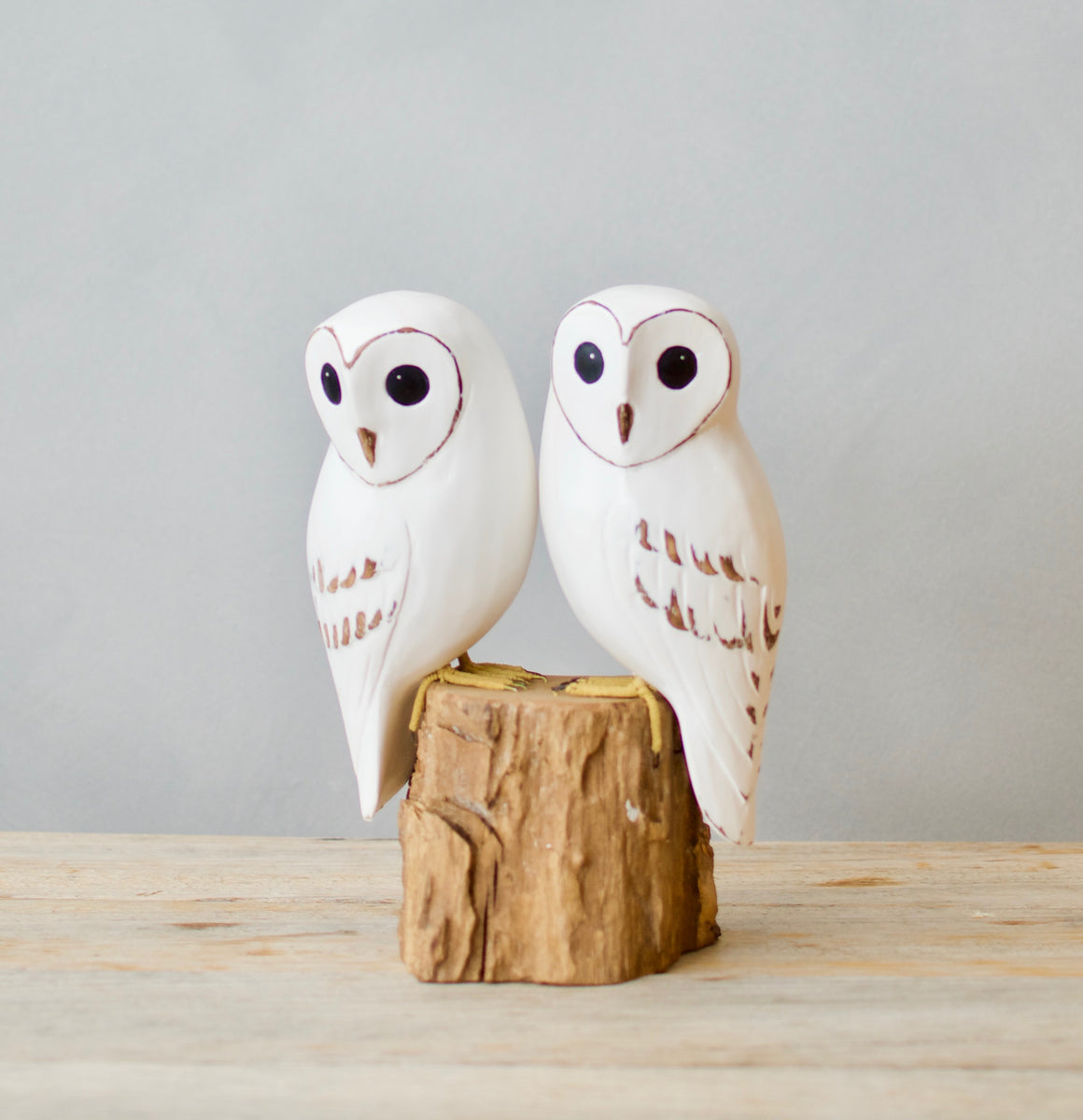 Hand carved wooden baby barn owl pair on natural log base
